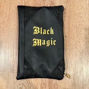 Black magic vegan leather makeup bag 
Excellent condition